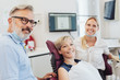 © contrastwerkstatt - Smiling female patient in a dentists surgery