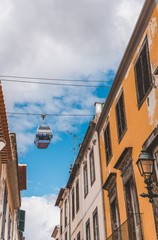 Poster - Vertical shot of cable cars over the buildings in Funchal, Madeira, Portugal