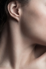 part of young woman neck and face closeup natural beauty care concept