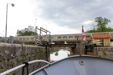 locks at Norsholm Sweden with train bridge