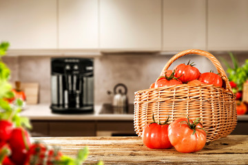 Fresh vegetables on wooden table in kitchen interior 