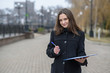 © Павел Костенко - Portrait of a business woman outdoors. Cold cloudy weather.