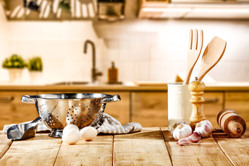 Sticker - Brown kitchen furniture with empty space on table.Copsy space and kitchen board.White cook hat and few kitchen utensils.Free space for your product and morning time. 