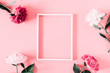 Beautiful flowers composition. Blank frame for text, pink and white peonies flowers on pastel pink background. Valentines Day, Easter, Birthday, Mother's day. Flat lay, top view, copy space