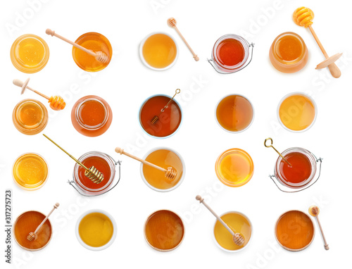 Photographie Set of organic delicious honey on white background