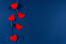 Red Hearts With Ribbon On Classic Blue 2020 Color Background. Valentines Day 14 February Concept. Flat Lay, Copy Space, Top View, Banner.