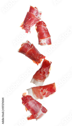 Cuadros en Lienzo Falling delicious sliced jamon on white background