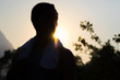 © KC - Silhouette of Asian Man in Sunset Glow