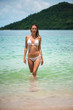 © katafree - Young slim beautiful girl stay and posing in the sea or ocean waves