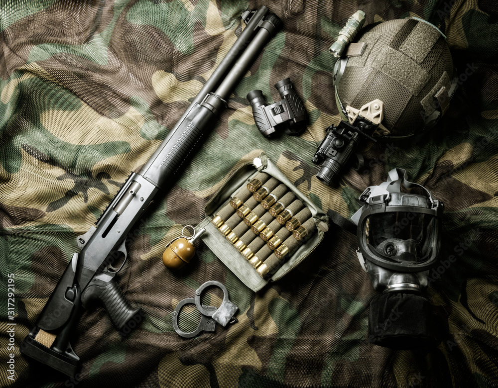 Set of weapons of a fighter of a special unit. Shotgun, ammo, grenade ...