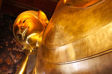 Reclining Golden Buddha Statue in Thai temple