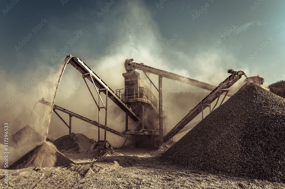 Industrial background with working gravel crusher - obrazy, fototapety, plakaty 