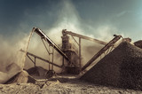 Fototapeta Sawanna - Industrial background with working gravel crusher