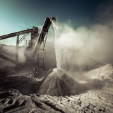 Fototapeta Sawanna - Industrial background with working gravel crusher