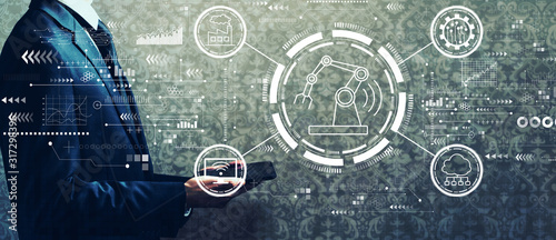 Fotomural Smart industry concept with businessman holding a tablet computer