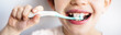 Long horizontal closeup cropped picture of child with toothbrush in mouth brushing healthy changing teeth. Cover. Dental and medical health care from childhood. Smiling child mouth with toothbrush