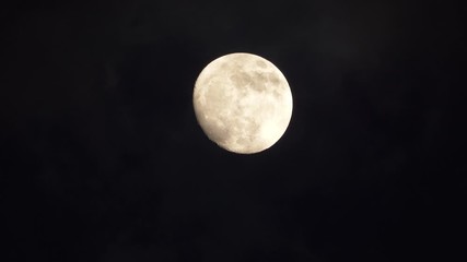 Wall Mural - Big full moon behind moving clouds in 4K 