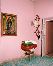 Virgin Of Guadalupe Painting Hanging On Wall At Home