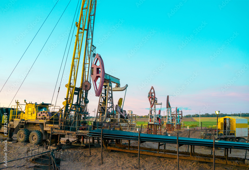 Basic Workover Rig Workover rig working on a previously drilled well trying to restore ...