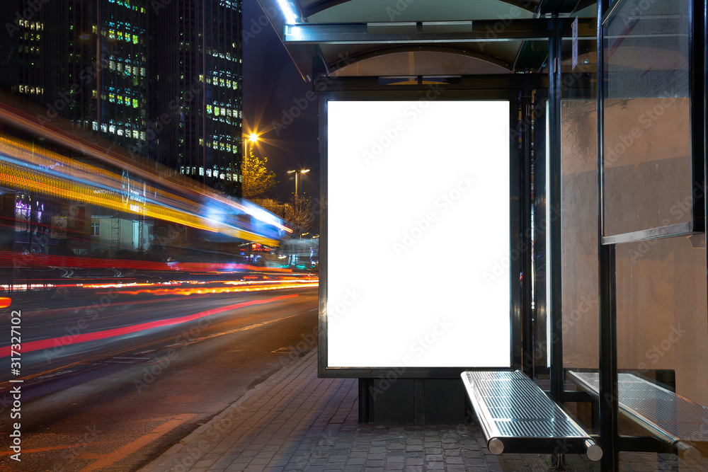 Blank billboard in night traffic - obrazy, fototapety, plakaty 