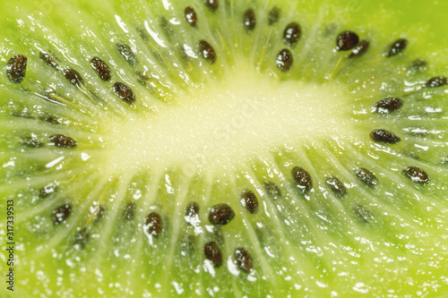 pieces of fresh green kiwi macro Tableau sur Toile