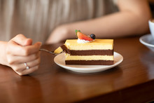 Elegant Woman Eating Cake In Cafe