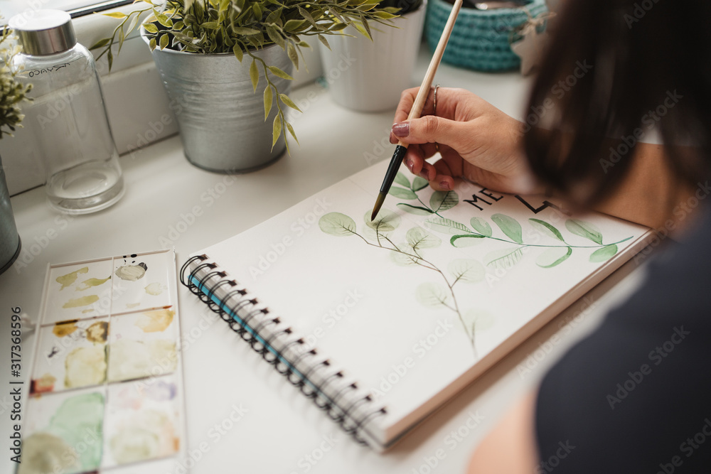 Crop from above view of unrecognizable woman drawing picture with ...