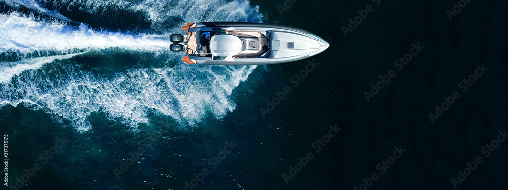 Aerial drone top down ultra wide photo of inflatable speed boat cruising in high speed in deep blue Aegean sea - obrazy, fototapety, plakaty 