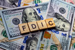 The word fdic on dollar usa background. USA Federal Deposit Insurance Corporation concept.