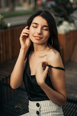 Wall Mural - Beautiful model posing for the camera on the street.