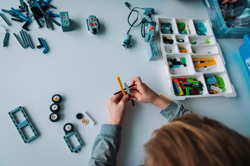 Poster - child building robot at robotic technology school lesson