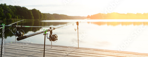 Fotomural Carp fishing on beautiful blue lake with carp rods and rod pods in the summer morning