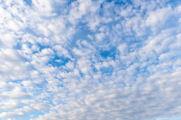 Fluffy clouds and blue sky on a clear day