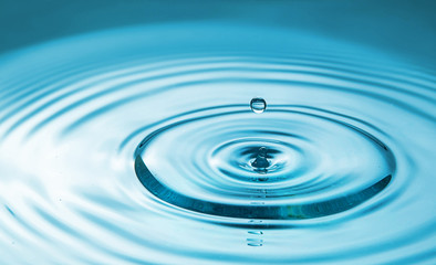  Closeup Water drop falling on the surface of the water and beautiful circular wave ripple, fresh natural mineral water drink water concept