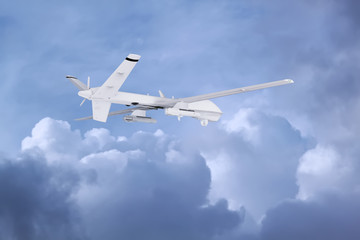 Wall Mural - military RC military drone flies against the backdrop of blue peaceful sky with white clouds