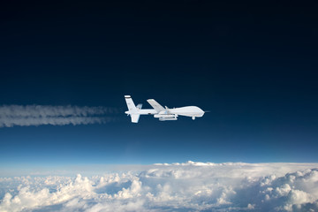 Wall Mural - military RC military drone flies flies against backdrop of beautiful clouds on blue sky background. Elements of this image furnished by NASA