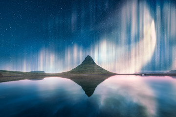 Wall Mural - aurora light behind kirkjufell mountain in iceland, europe. landscape photography