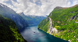 Panorama of breathtaking view of Sunnylvsfjorden fjord and famous Seven Sisters waterfalls, near Geiranger village in western Norway. Landscape photography