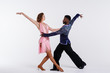 © Olga - Black man and white woman dancing couple, fitness concept. Dancers on a white background