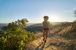 © Joshua Resnick - fit african american woman hiking up runyon canyon at sunset