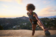 © Joshua Resnick - athletic african american woman doing stretches at runyon canyon