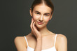 © Beauty Agent Studio - Face skin care. Beautiful young woman applying anti age eyes cream. Beauty treatment and spa concept.