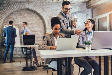 Group of business people working in office and discussing new ideas