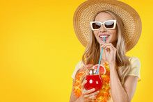 Beautiful Smiling Woman In Summer Dress With Cocktail Isolated On Yellow Background