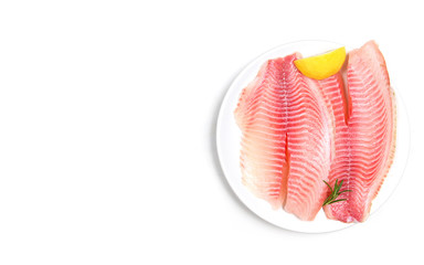 Wall Mural - Fresh fish fillet sliced for steak or salad with herbs spices rosemary and lemon - Raw tilapia fillet fish on white background and ingredients for cooking food