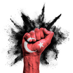 Wall Mural - Turkey raised fist with powder explosion, power, protest concept