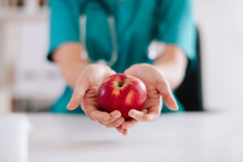 Apple In Hand. Nutritionist Holding Red Apple In Hands. 