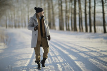 Fashionable Man In A Coat / Winter Style, Walk Against The Backdrop Of The Winter Landscape, Snowy Weather, Warm Clothes