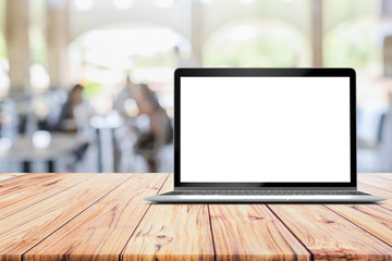 Poster - Laptop blank mock up screen placed on wooden table on Defocused customer at restaurant cafe coffee shop blurred