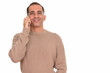 © Ranta Images - Mature happy Persian man talking on mobile phone